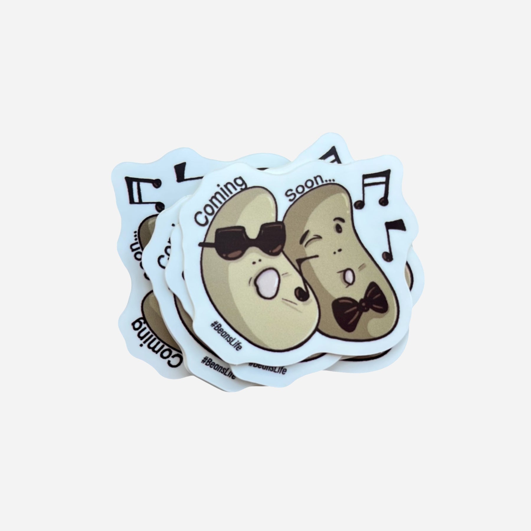 Set of four stickers with cartoon potato characters wearing bow ties on a light blue background.