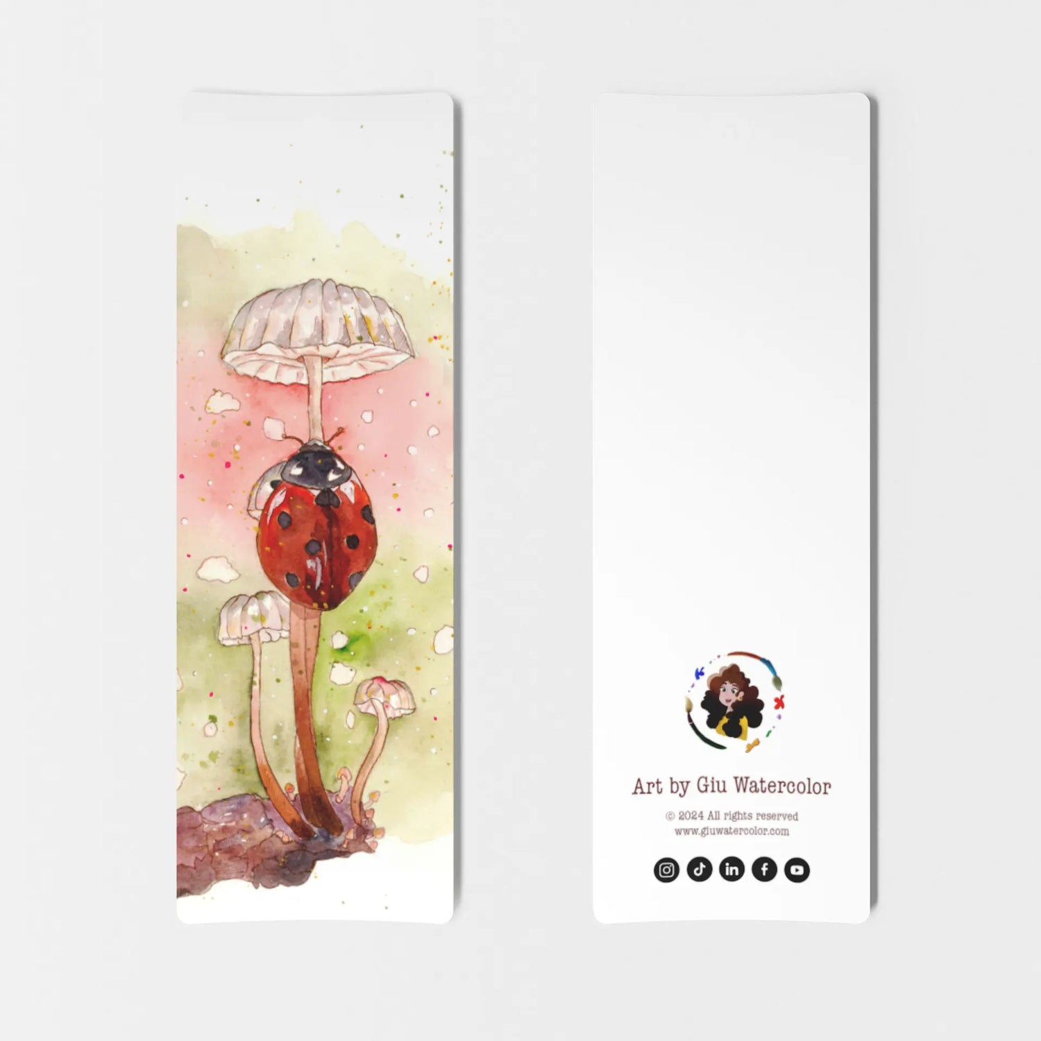 Watercolor bookmark of a red ladybug resting under a mushroom — charming illustration by Giulia Giampaolo.