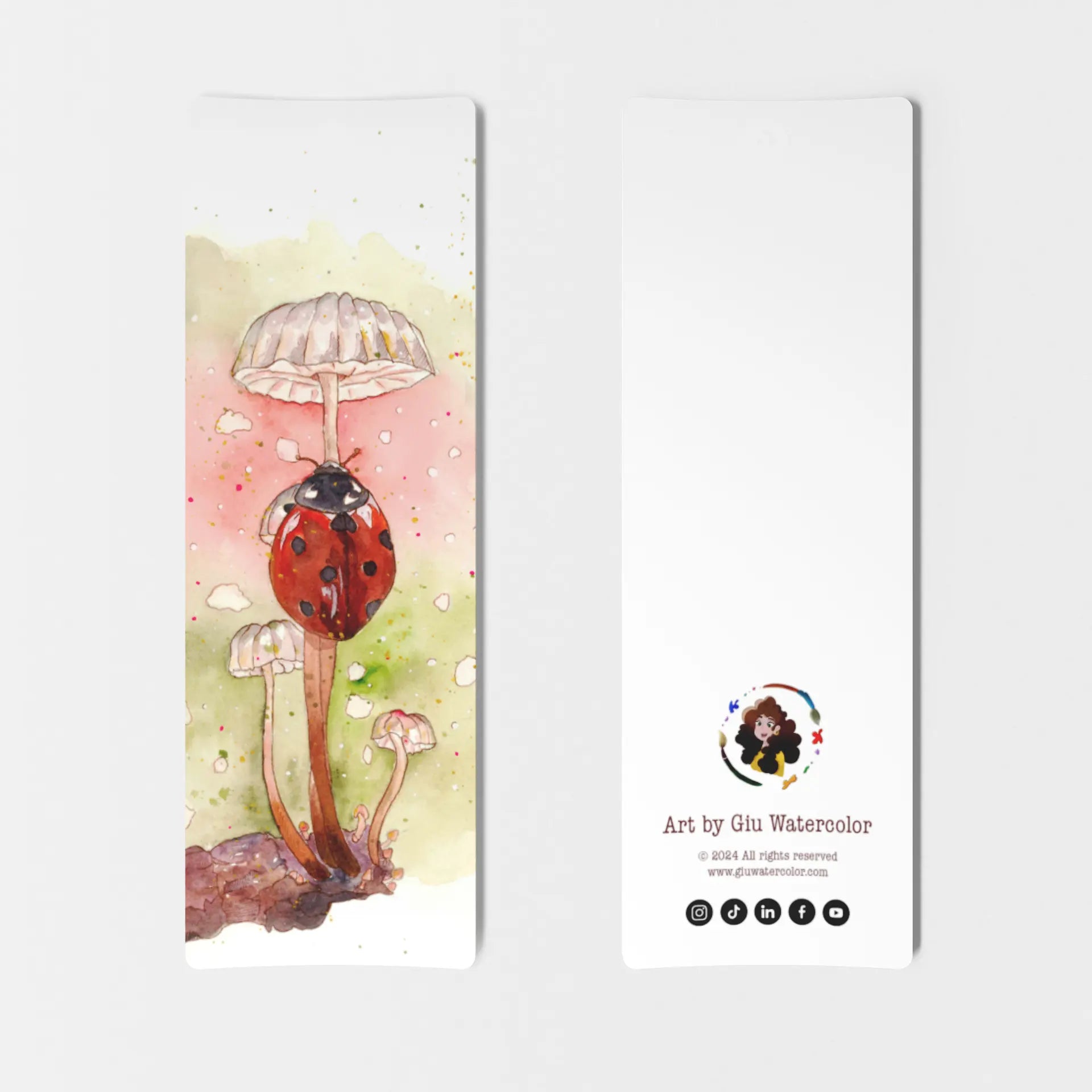 Watercolor bookmark of a red ladybug resting under a mushroom — charming illustration by Giulia Giampaolo.