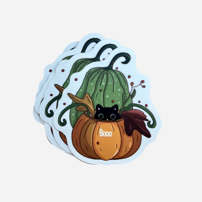 A pack of Halloween stickers featuring a cute black cat inside an orange pumpkin with green vines, illustrated by Giulia Giampaolo.