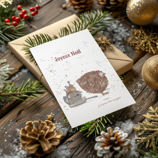Christmas card with hedgehog illustration surrounded by festive decorations on a wooden surface